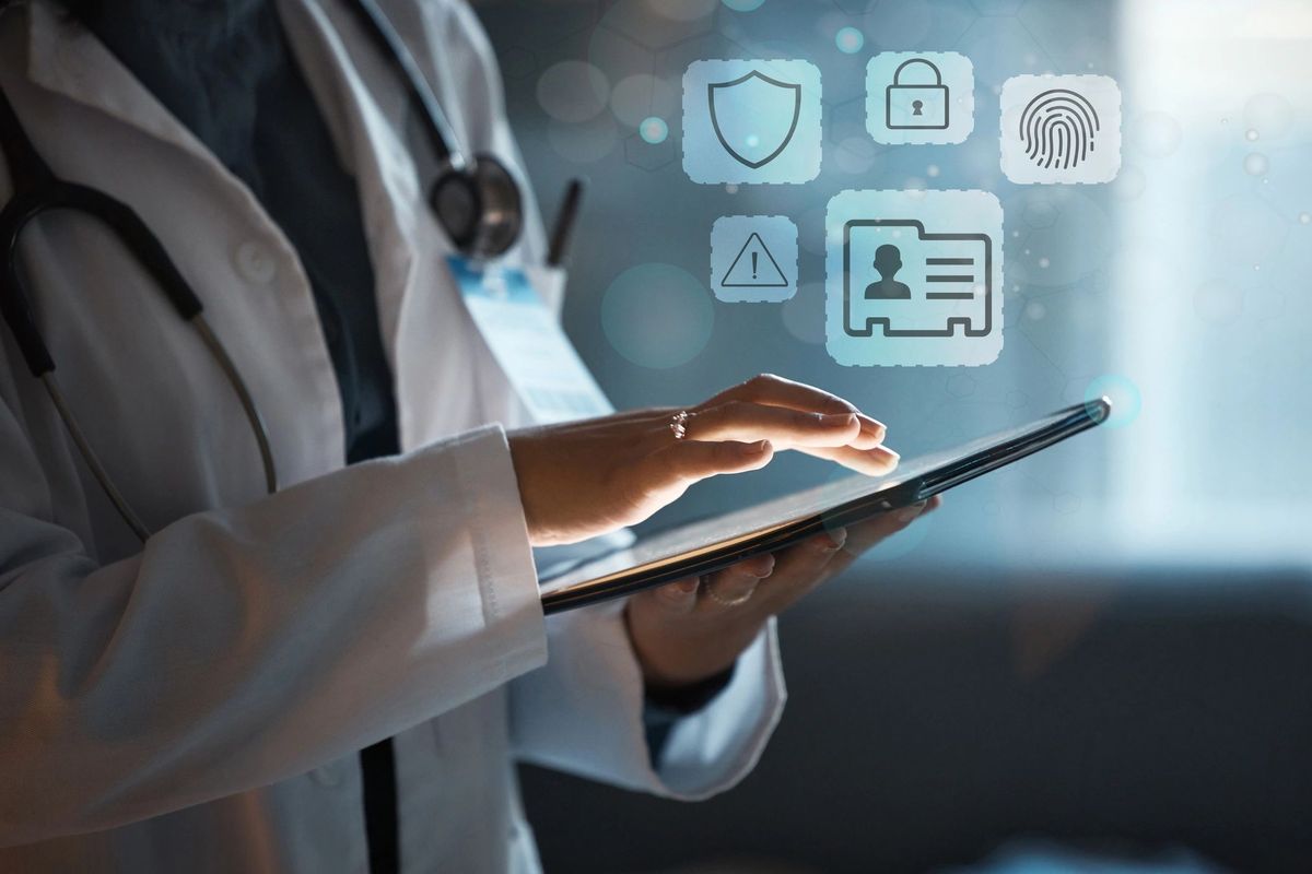 Doctor using tablet with floating data-security icons