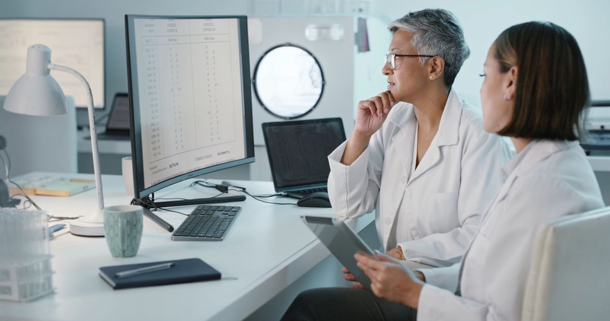 Scientists reviewing genetic report